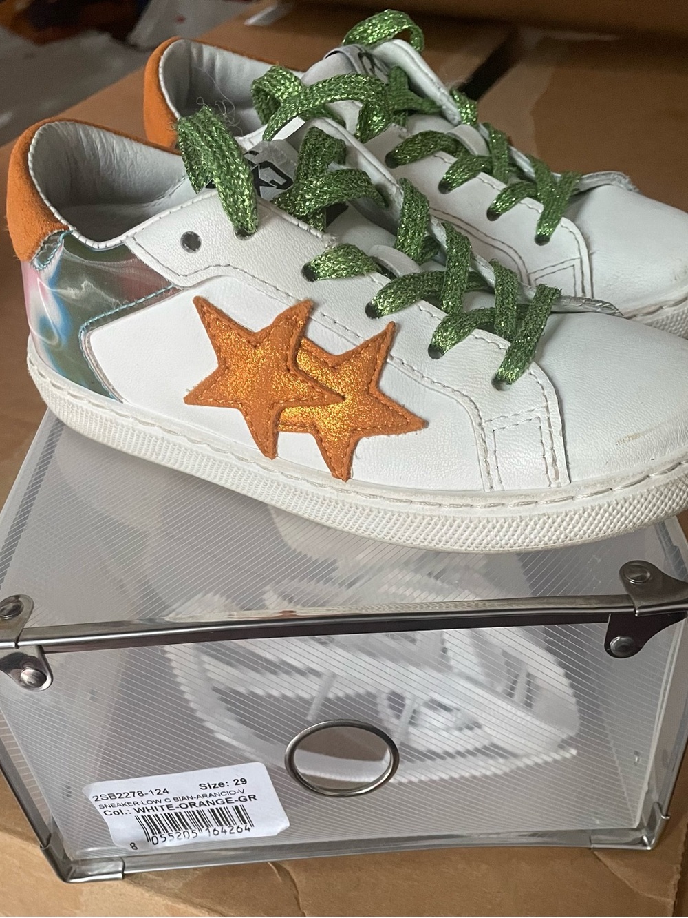 Kids White Sneakers with Orange Star Accents and Green Glitter Laces
